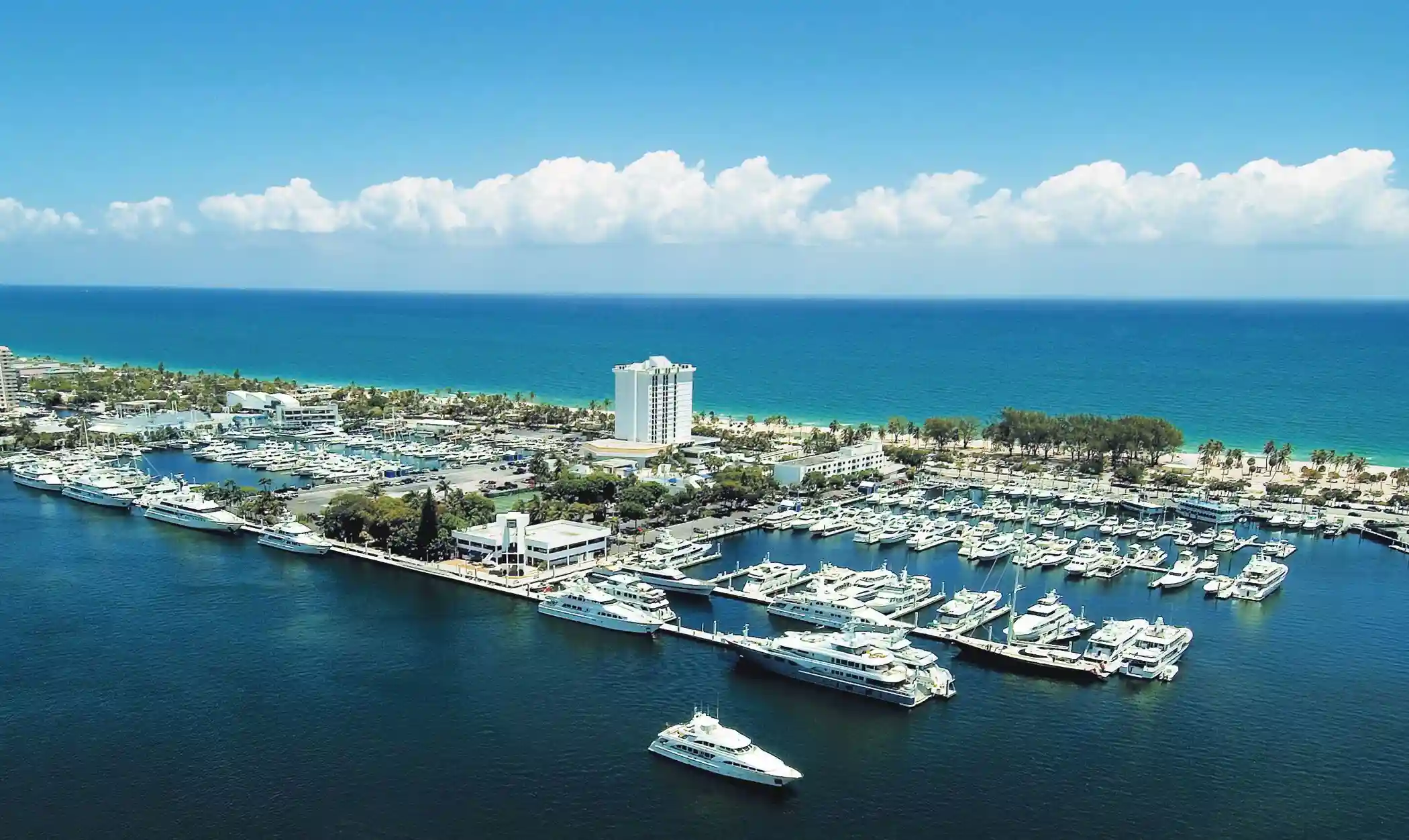 Aerial view of Bahia Marina in Fort Lauderdale, Florida, with clouds in the background.