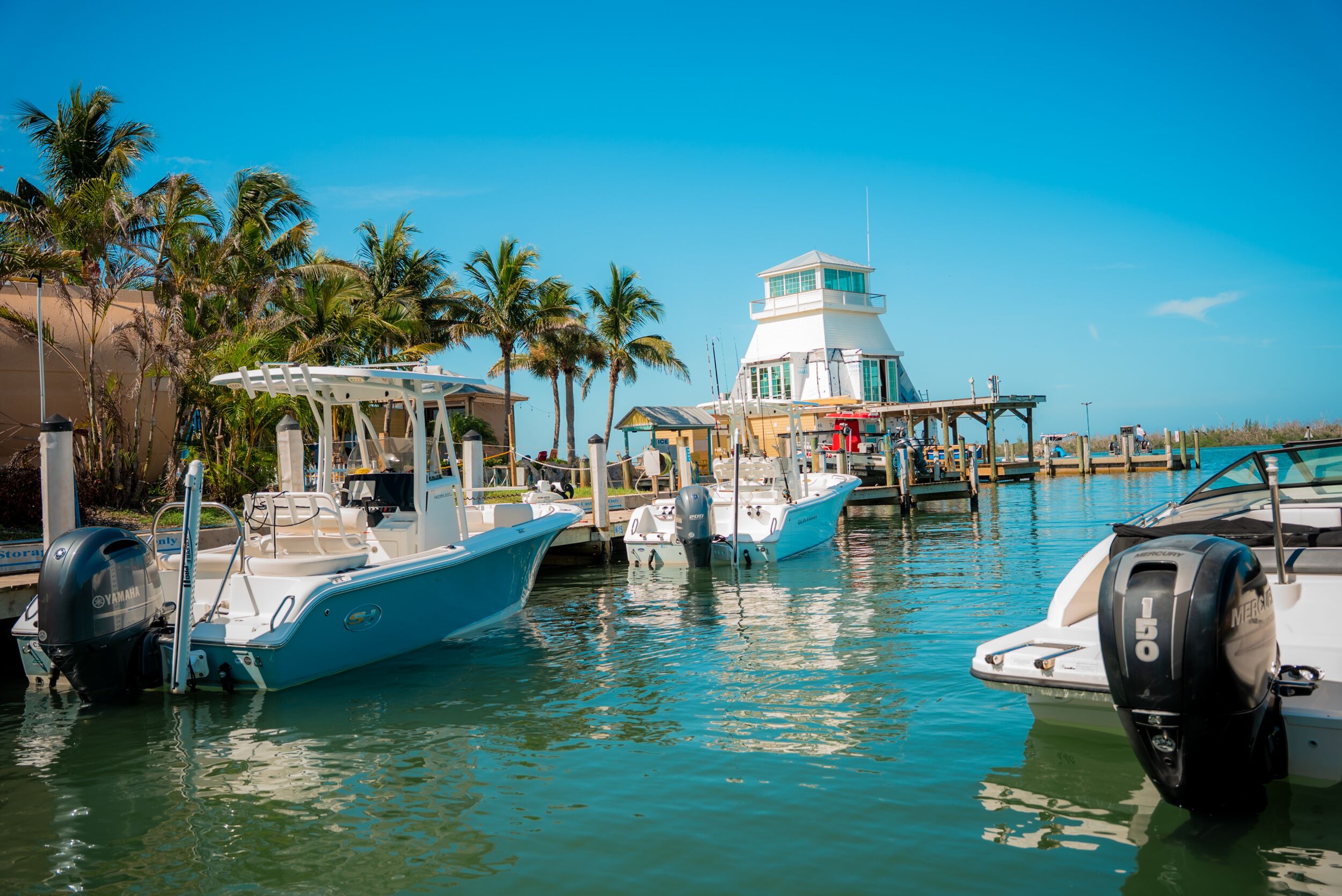Boats parked in Stump Pass Marina in Florida on a sunny day.